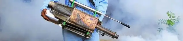 Fumigation technician using a fogger for deep pest treatment in Lakeland, FL